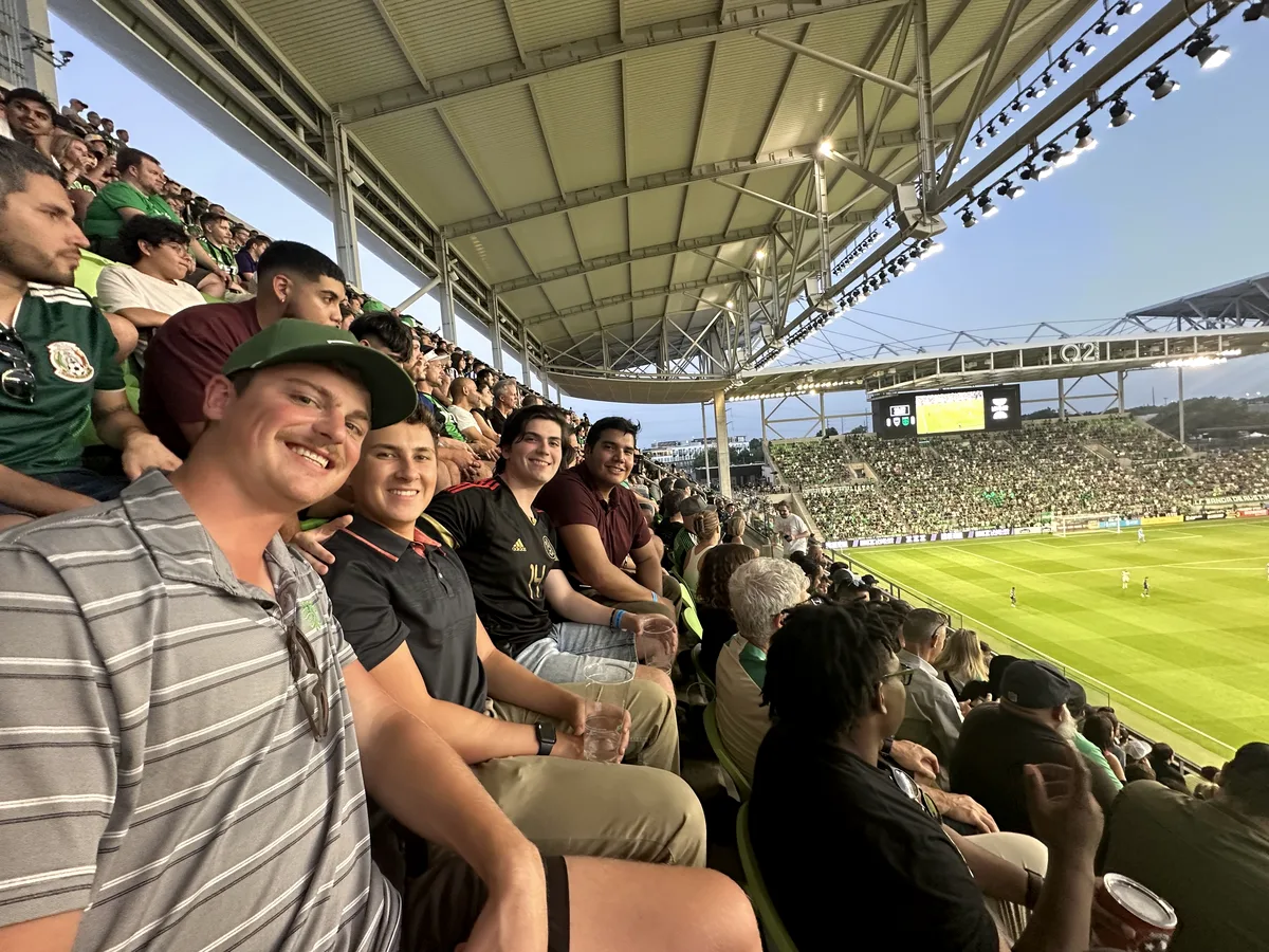 Soccer stadium Mahoney Engineering employees enjoying an outing at soccer stadium