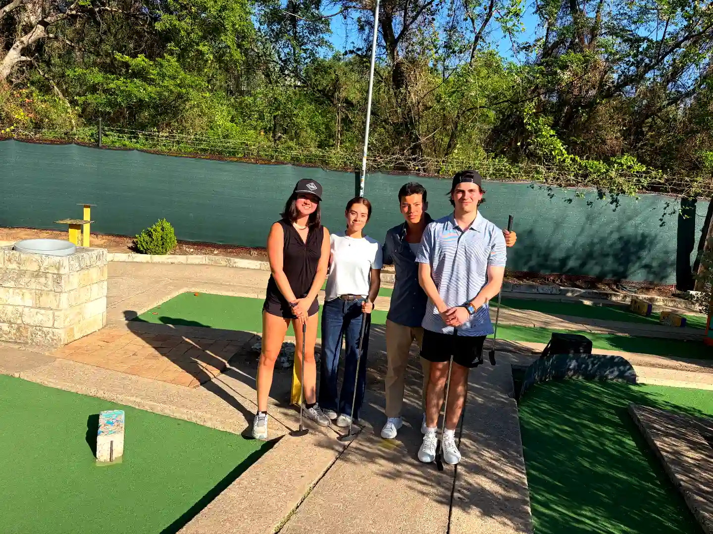 Soccer stadium Mahoney Culture - Employees attending a putt putt golf work outing event