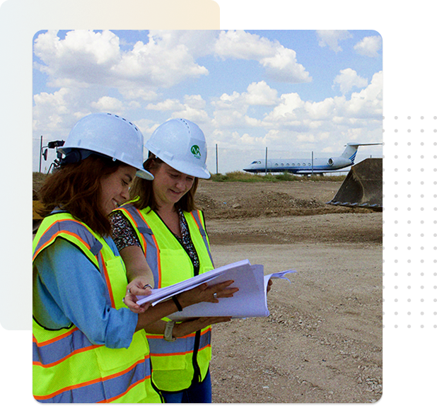 es_main_men Two engineers reviewing plans on site
