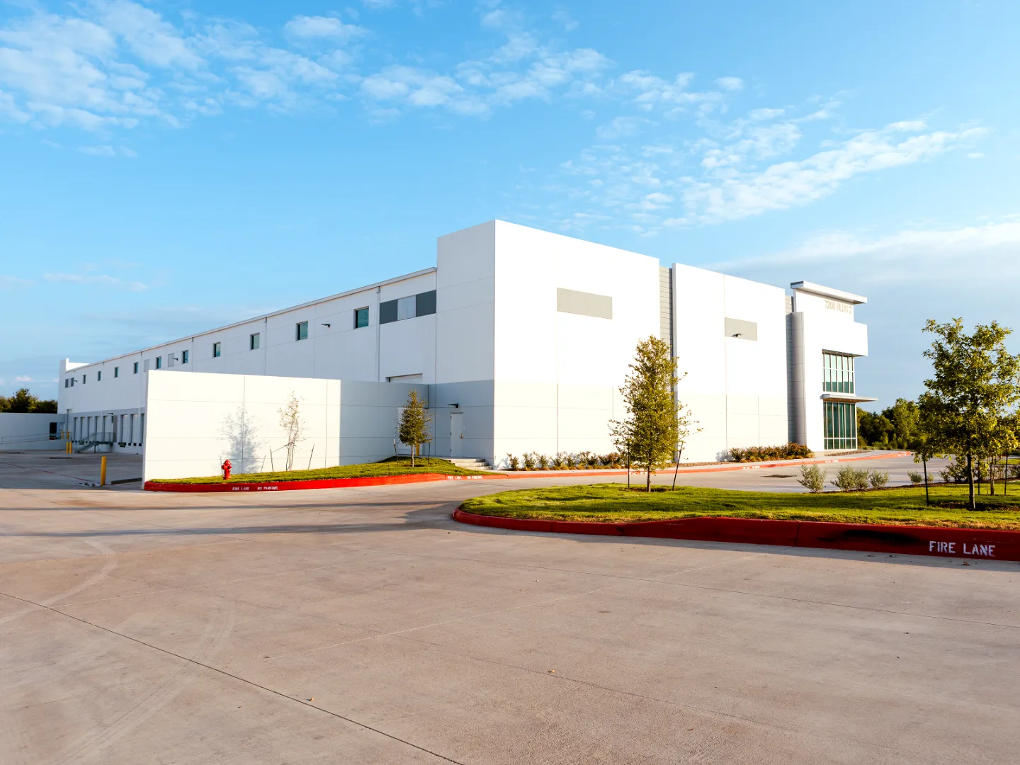 Completed Colorado Crossing industrial building with fire lane and landscaping in Austin, Texas